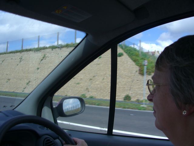 Sue driving along the sea front