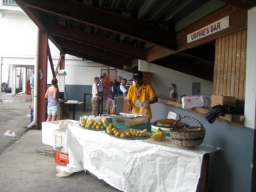 Fruit and drink on sale behind the stand