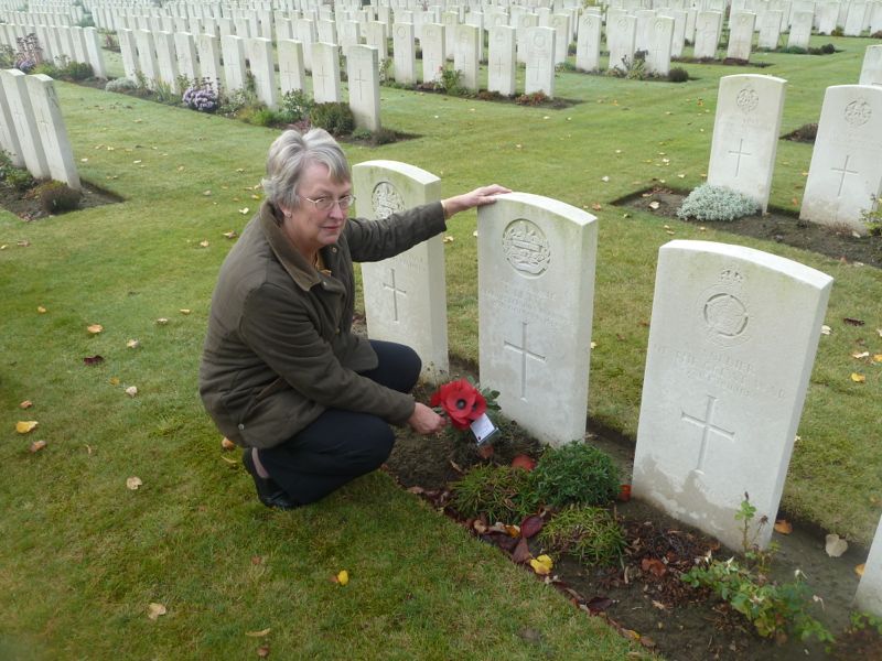Sue lays a wreath on the grave of Ernest Letts